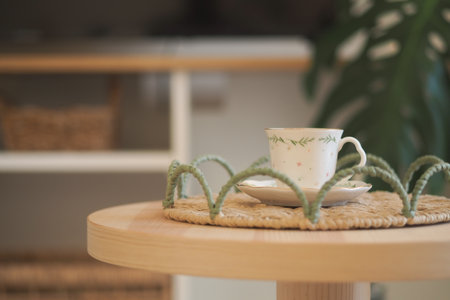 Nicely arranged cup of tea on a cozy wooden tableの写真素材
