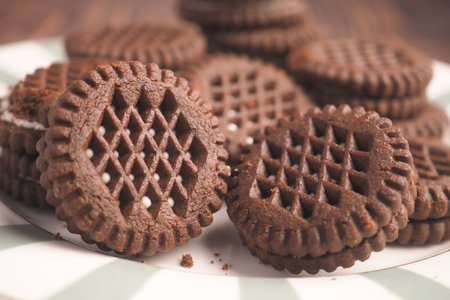 Chocolate sandwich cookies on a plate ready to enjoyの写真素材