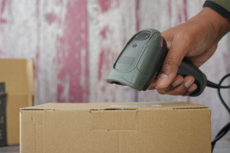 Scanning a barcode on a cardboard box for inventory tracking