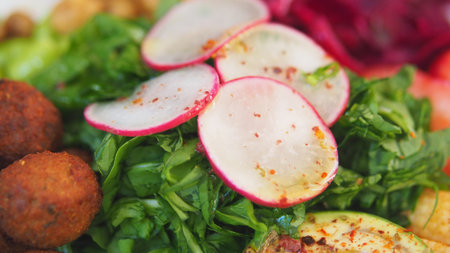 Fresh salad with colorful vegetables and tasty toppings