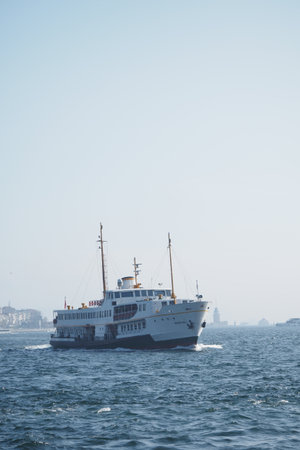 turkey istanbul 27 may 2025. Ferry sailing through calm waters near a coastal cityのeditorial素材