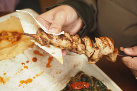 Cozy grilled chicken skewers with sidesの写真素材