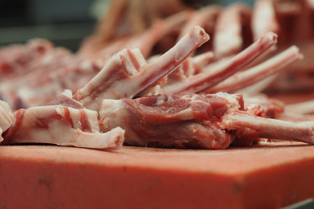Fresh lamb chops ready for sale in a market stallの写真素材