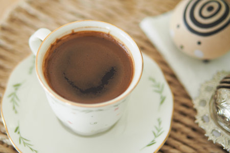 Enjoying turkish coffee in a cozy setting with artful accentsの写真素材