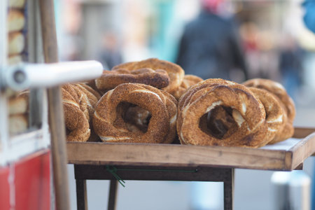 Freshly baked simit on display at street marketの写真素材