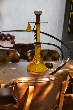 Colorful hookah on a wooden table in a cozy setting
