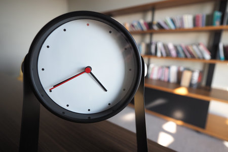 Modern clock placed on a desk in a stylish office space