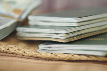 Passports and cash on a travel preparation tableの写真素材