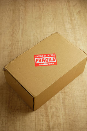 Package with warning label rests on a wooden surface