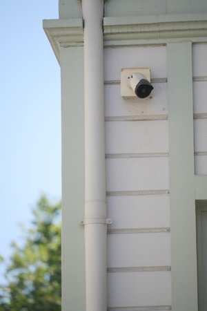 Camera on a building, clear sky behind