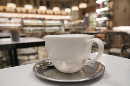 Enjoying coffee in a cozy cafe during the afternoonの写真素材