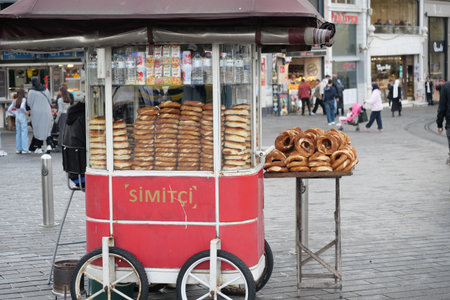 turkey istanbul 22 june 2025. Simit vendor sells bread rings in busy city squareのeditorial素材