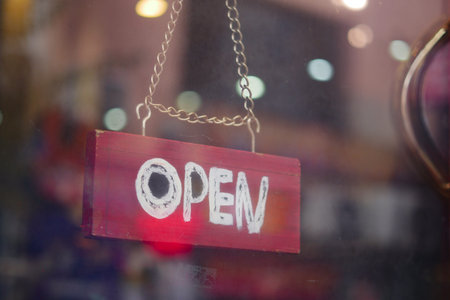 Sign shows store is open for customers in the city
