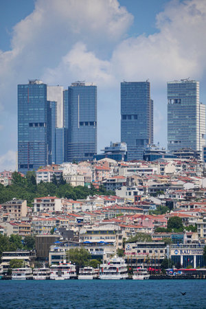 turkey istanbul 22 july 2025, City buildings rise above small houses along the waterfront in istanbulのeditorial素材