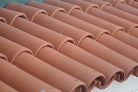 Roof tiles arranged in neat rows during construction work