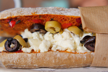 Fresh sandwich made with olives and cheese on tableの写真素材