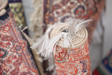 Rolls of rugs are displayed in a shop for saleの写真素材