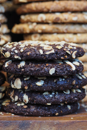 Freshly baked cookies stacked for sale in a bakery
