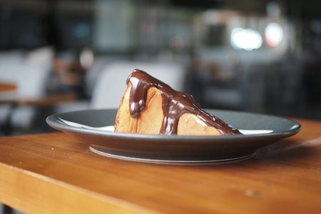 cheesecake wtih chocolate sauce on a table