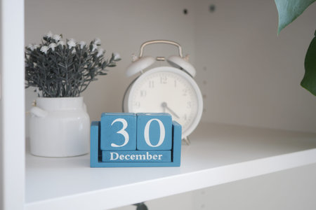 Calendar shows date of December 30 with clock on shelf