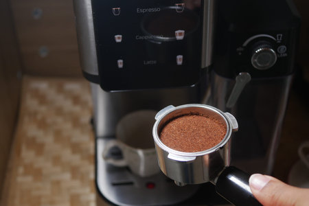 Making espresso with a coffee machine at home