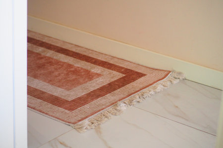 Rug placed on a tiled floor in a hallwayの写真素材