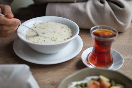Enjoying soup and tea at a local cafe in the afternoonの写真素材