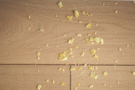 Chips scattered on wooden surface in indoor setting