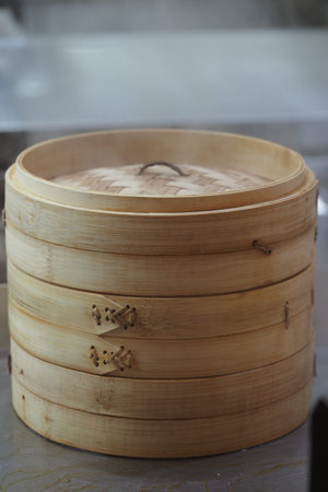 Steam basket sits ready in a kitchen for cooking foodの写真素材