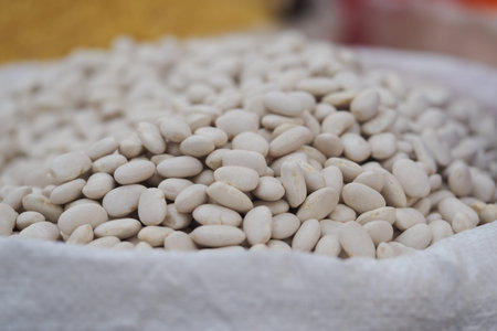 White beans in a sack at a market in the morning