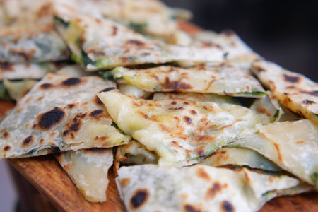 Flatbreads on a wooden board in a kitchen setting