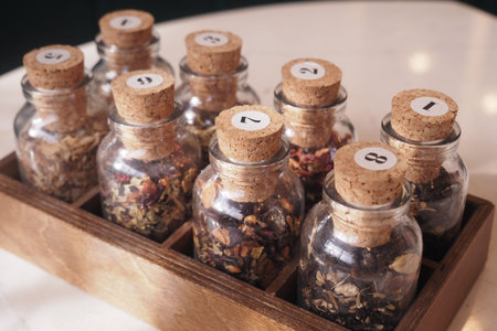 Display of jars with various herbs and spices on a table
