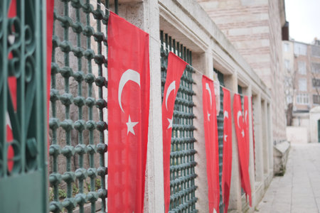 Turkish flags adorn a quiet city wall