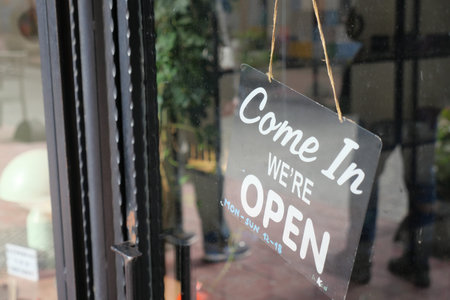 Come in and shop at local store with open signの写真素材