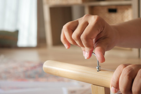 Assembling a wooden chair in a bright room