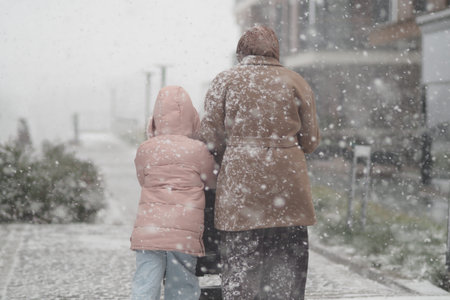 Walking in the snow during a winter day