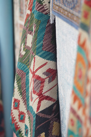 Patterns on woven fabric hanging in a studio