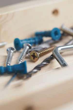 Tools and screws on wooden surface for construction projectの写真素材
