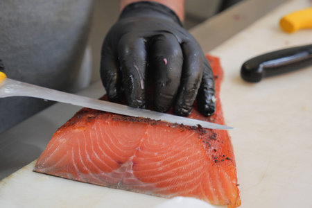 Fish fillet preparation in a kitchen setting