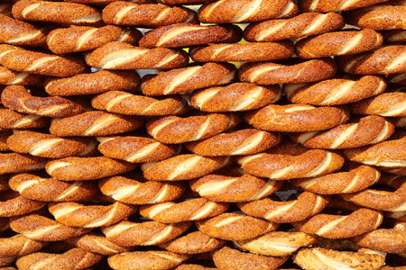 Freshly baked turkish simits on display at a market stall