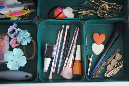 Items organized in small containers for personal care tasksの写真素材