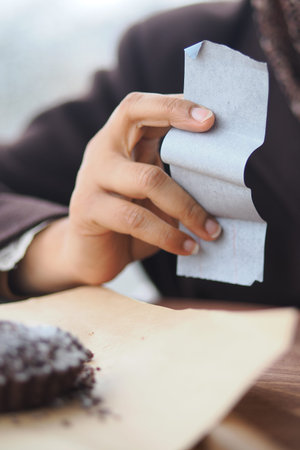 woman hand holding a payment receipt