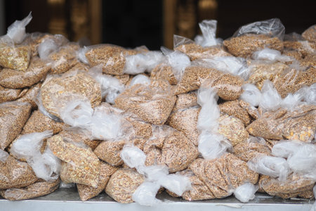 Stacked Plastic Bags of Packaged Grains for Market Sale in Bulk