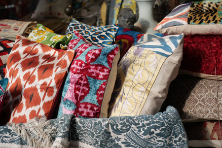 Colorful pillows stacked in an indoor market