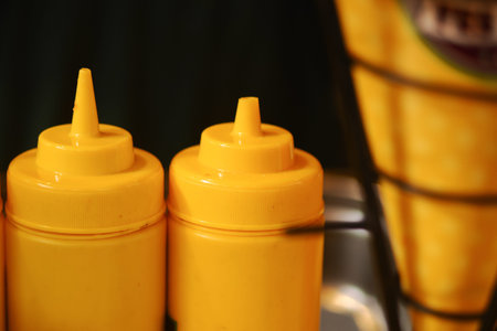 Mustard containers on display in a food setting