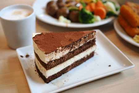 Dessert served with coffee and salad on a table