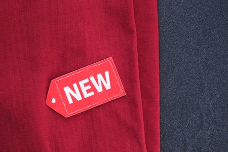 Red fabric with new tag on display