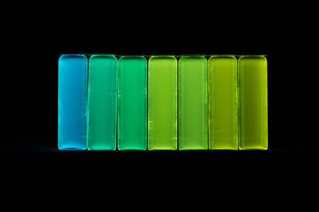 Fluorescent chemicals under UV light.の写真素材