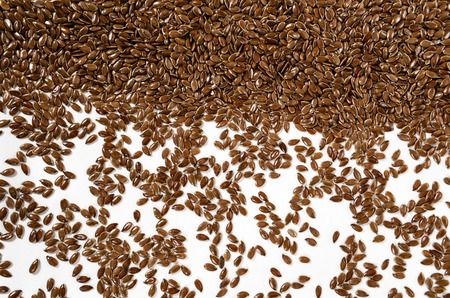 close up of flax seeds isolated on white backgroundの写真素材