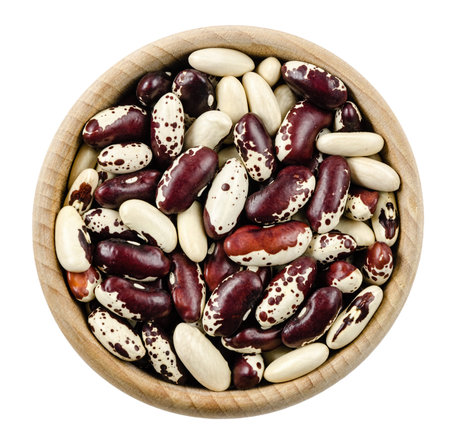 Red haricot in wooden bowl isolated on white background